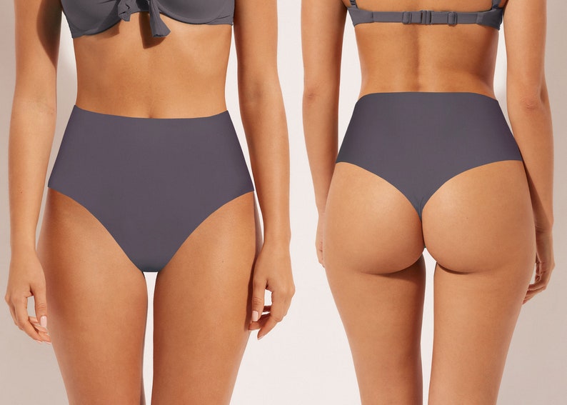 May include: High-waisted bikini bottoms in a dark gray color. The bottoms have a thong back style.