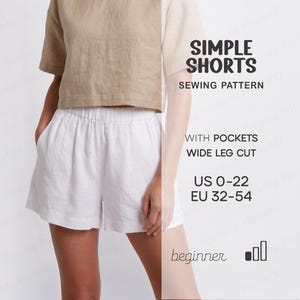 Könnte beinhalten: Ein Schnittmuster für einfache Shorts mit Taschen und weitem Bein. Der Text lautet Simple Shorts Sewing Pattern, with pockets, wide leg cut, US 0-22, EU 32-54 und beginner. Die Shorts sind weiß und haben einen elastischen Bund.