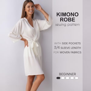 Puede incluir: Una bata kimono blanca con bolsillos laterales y mangas 3/4, diseñada para tejidos. El texto en la imagen dice "KIMONO ROBE patrón de costura" y "PRINCIPIANTE".