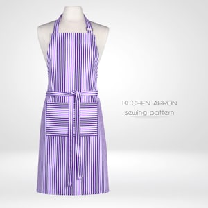 Może przedstawiać: Fioletowo-biały pasiasty fartuch kuchenny z kieszenią i wiązaniem. Fartuch jest na białym manekinie. Tekst "KITCHEN APRON sewing pattern" znajduje się pod fartuchem.