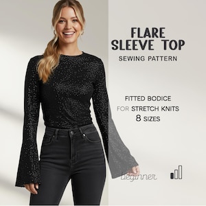 May include: A woman wearing a black, long-sleeved top with flared sleeves and dark jeans. The image includes text that reads "FLARE SLEEVE TOP SEWING PATTERN" and "FITTED BODICE FOR STRETCH KNITS 8 SIZES".