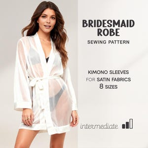 May include: A white, sheer bridesmaid robe with kimono sleeves and a matching tie belt. The image includes text that reads "Bridesmaid Robe Sewing Pattern" and details about the pattern's features, including "Kimono Sleeves for Satin Fabrics" and "8 Sizes."