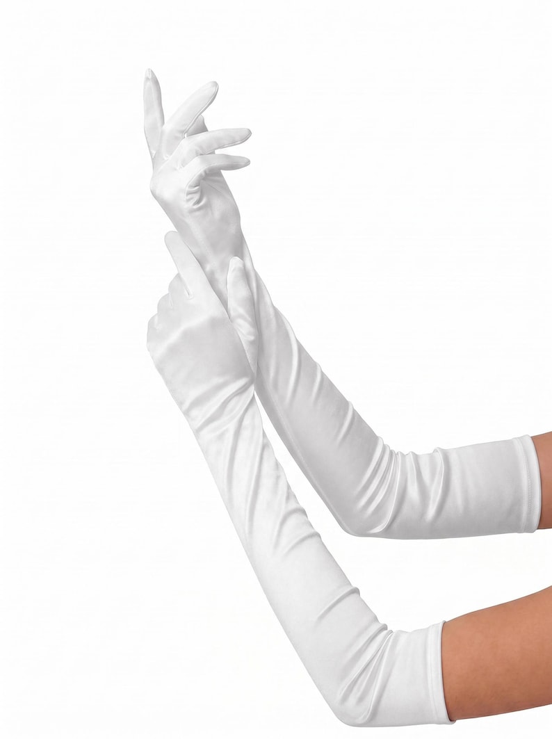 May include: White satin opera gloves. These elegant, long gloves extend past the elbow. The gloves are made of a smooth, shiny fabric and are ideal for formal events or costumes.