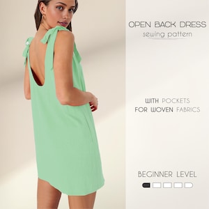 May include: A green open back dress sewing pattern with pockets for woven fabrics. The pattern is for beginner sewers and includes a difficulty level indicator.