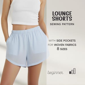 May include: Light blue lounge shorts with side pockets, designed for woven fabrics. The image also includes the text "LOUNGE SHORTS SEWING PATTERN" and "8 SIZES". The shorts are shown on a person.