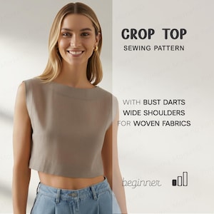 May include: A woman wearing a taupe crop top and blue jeans. The crop top has wide shoulders and a boat neck. Text on the right side reads "CROP TOP SEWING PATTERN" and "WITH BUST DARTS WIDE SHOULDERS FOR WOVEN FABRICS".