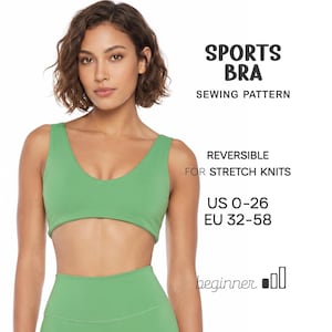 May include: A green sports bra sewing pattern for stretch knits. The text reads: SPORTS BRA SEWING PATTERN, REVERSIBLE FOR STRETCH KNITS, US 0-26, EU 32-58, and beginner with three bar icons. The bra features a scoop neckline and a cropped hem.