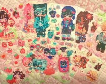 May include: A collection of colorful stickers featuring anime-style characters, strawberries, cakes, and hearts. The stickers have a cute, kawaii aesthetic with various poses and accessories. Some stickers have text like "Chu!" and "Doki!"