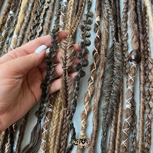 This set is Mix different styles THIN braids and dreads beige,brown,black,blond.This set can be Double ended dreads(DE)or Single ended dreads(SE)variation.This kit of dreads made by Synthetic hair - Kanekalon. The material is light & absolutely safe