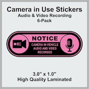 May include: Pink and black laminated sticker with the text "NOTICE CAMERA IN VEHICLE AUDIO AND VIDEO RECORDED." The sticker also features a camera icon and a microphone icon. The sticker measures 3.0" x 1.0".