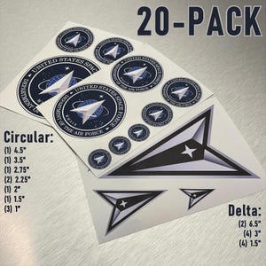 May include: A 20-pack of United States Space Force decals in circular and delta shapes. The circular decals feature the Space Force logo with a blue and white color scheme. The delta decals are black and white with a star in the center. The decals are available in various sizes, including 4.5 inches, 3.5 inches, 2.75 inches, 2.25 inches, 2 inches, 1.5 inches, and 1 inch.
