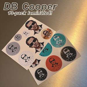 May include: A set of 13 laminated stickers featuring a black and white illustration of a man with the text "I'll Do The Job 1971". The stickers are in various colors, including gray, blue, red, and green.