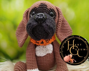 May include: A brown and black crocheted dog toy with a white collar and a silver charm that says "made with love".