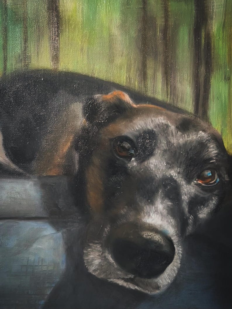 May include: An oil painting depicting a dog with black and brown fur, looking directly at the viewer. The dog has brown eyes and a black nose. The background shows a blurred green and brown forest scene.