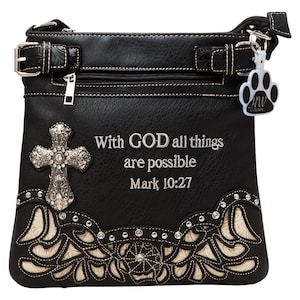 May include: Black faux leather crossbody purse with a silver cross and rhinestones. The purse has a white floral design and the text "With GOD all things are possible Mark 10:27".