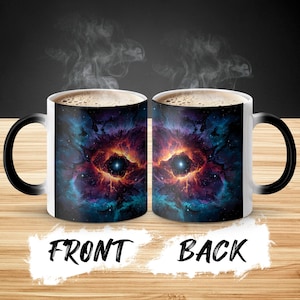 May include: A pair of white ceramic mugs with black handles, featuring a vibrant nebula design in shades of red, blue, and purple. The front and back of the mugs are labeled with the words "FRONT" and "BACK" in bold, black text.