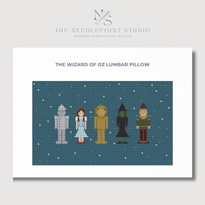May include: A needlepoint lumbar pillow featuring a pixelated design of the characters from The Wizard of Oz: Dorothy, the Tin Man, the Cowardly Lion, the Wicked Witch of the West, and the Scarecrow. The characters are standing in a row against a blue background with white stars.