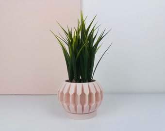 Minimalist plant pot for a refined decoration.