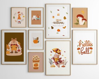 May include: A set of nine printable wall art prints featuring autumnal themes. The prints feature illustrations of a fox holding a pumpkin, a bear with an umbrella, a gnome, mushrooms, a truck with pumpkins, a cup of coffee, and text that says "hello autumn" and "hello fall".