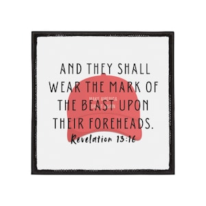 May include: A white patch with black stitching around the edges. The patch features a red baseball cap with the text "Make America Great Again" on it. The text "And they shall wear the mark of the beast upon their foreheads. Revelation 13:16" is printed in black below the cap.