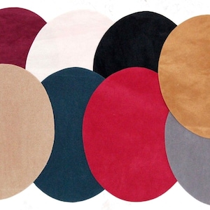 May include: Eight round felt coasters in various colours, including burgundy, beige, white, black, teal, red, grey, and brown.