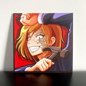 May include: A square art print featuring a stylized illustration of a person with short brown hair, a wide grin, and intricate rose tattoos on their face. The person holds a hammer in one hand and nails in the other against a vibrant red background.