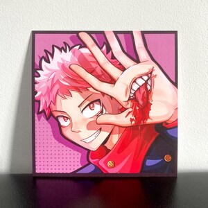May include: A square art print featuring a stylized anime character with spiky pink hair and red eyes. The character holds a hand up, revealing a mouth with white teeth and a red tongue embedded in the palm, with red liquid dripping from the wound.