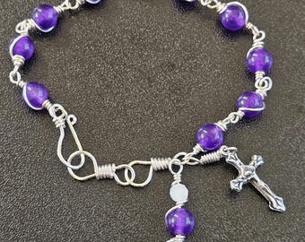 B04- Rosary bracelet.  Decade rosary.  6mm round deep royal purple agate glass beads.  Hand wire wrapped in interlocking links. Simple look.
