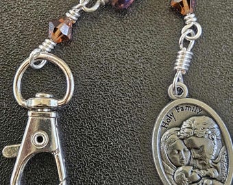 K07 - Handmade.  Guardian Angel and Holy Family pendant key chain.  Hand wrapped multi-facetted champagne w purple toned rondelle beads