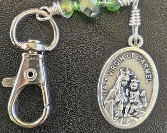 K06-  Handmade Christian Key chain.  Sacred heart of Jesus.  Emerald green crystal beads.  Lady of Mt Carmel and sacred heart of Jesus