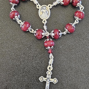D113-Handcrafted rosary.  1 decade.  Beautiful. 6mm x 8mm ruby red faceted stone rondelle beads. Chaplet. Pocket rosary.
