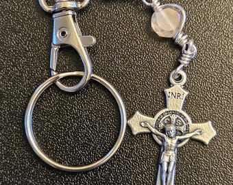K03-  Handmade Christian key chain. St. Benedict key chain.  Light pink facetted coin crystal bead. Hand wired and hand wrapped.