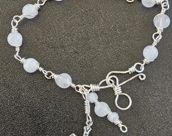 B07- Rosary bracelet.  Decade rosary.  6mm round snow white agate glass beads.  Hand wire wrapped in interlocking links. Simple look.