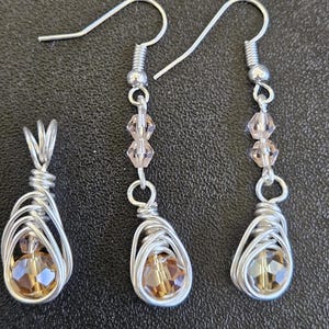 E07-  Handmade.  Champagne rondelle facetted earrings and matching pendant.   Unique. herringbone wrapped beads.