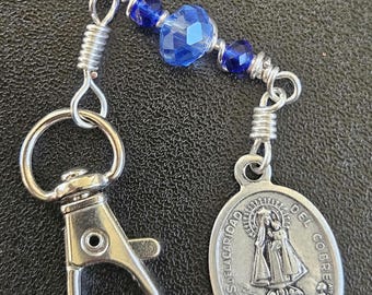 K10-  Handmade.  Mary and child Key chain.  Hand wrapped multi-facetted sky blue and royal blue rondelle beads (6mmx 8mm and 3mmx4mm).