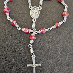 D070-  Handmade decade rosary.  4mmx6mm multifaceted irridescent ruby red rondelle crystal beads. Pocket Rosary. tenner rosary. 3 variations