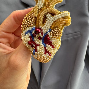Embroidered brooch anatomical heart. Beige heart brooch embroidered with crystals and beads