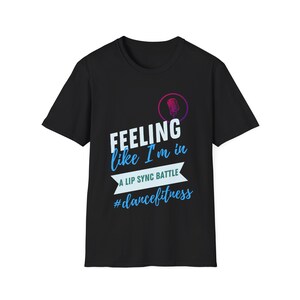 May include: Black t-shirt with a white microphone graphic and the text "Feeling like I'm in a lip sync battle #dancefitness".