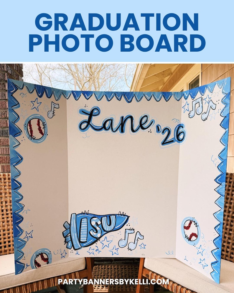 May include: A white tri-fold graduation photo board featuring hand-painted blue accents. The board displays the name Lane, the year '26, a blue pennant with the letters ISU, baseballs, musical notes, and stars, all framed by a blue zigzag border.