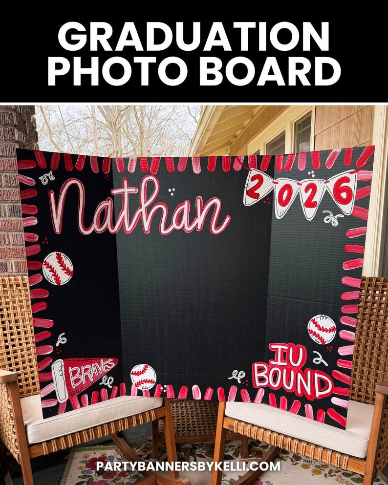 May include: A black tri-fold graduation photo board featuring hand-painted red and white baseball-themed decorations. The board displays the name Nathan, the year 2026 on pennants, the text IU BOUND, and a pennant labelled BRAVES in red and white.
