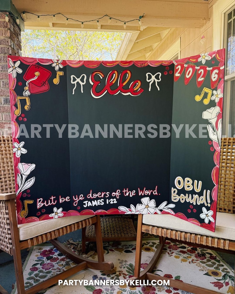 May include: A tri-fold black display board featuring hand-painted red and white floral borders, musical notes, and a graduation cap. The board displays the name Elle, the year 2026, the text But be ye doers of the Word. JAMES 1:22, and OBU Bound!
