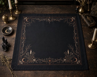 May include: A square black altar cloth featuring a detailed border print in copper and gold tones. The design includes celestial motifs like crescent moons, stars, and sunbursts, intertwined with botanical elements, bare branches, and candles.