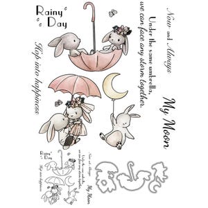 May include: A charming watercolour illustration of bunnies with umbrellas and a crescent moon balloon. Text includes "Rainy Day," "Hop into happiness," and "My Moon."