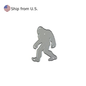 May include: Metal die cut of a Bigfoot silhouette. The die cut is silver in color and is designed for crafting projects.