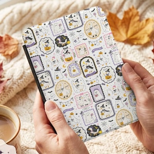 May include: A rectangular e-reader case featuring a repeating pattern of cartoon geese dressed as ghosts and witches, pumpkins, and bats on a white background. The design includes framed illustrations with the text Silly Goose and Boo.