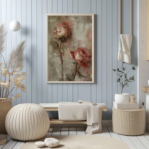 May include: A framed painting of two pink roses with green stems and leaves against a textured, light brown background.