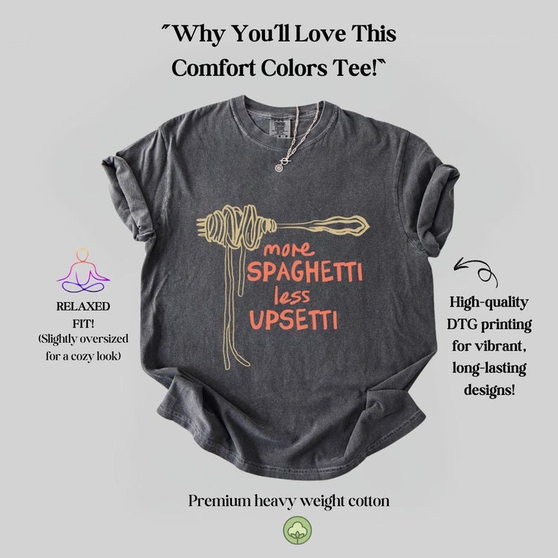 May include: A dark gray t-shirt with a relaxed fit featuring a graphic of a fork and spaghetti with the text "more spaghetti less upsetti". The shirt is made of premium heavy weight cotton and features high-quality DTG printing for vibrant, long-lasting designs.