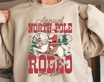 ANNUAL NORTH POLE Rodeo Sweatshirt, Cowboy Santa Shirt, Santa Roping Horse Shirt, Rodeo Christmas Sweatshirt, Country Western Christmas Gift