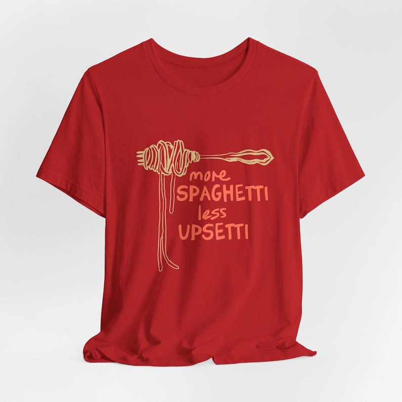May include: Red t-shirt with a graphic of a fork with spaghetti on it and the text "more spaghetti less upsetti".
