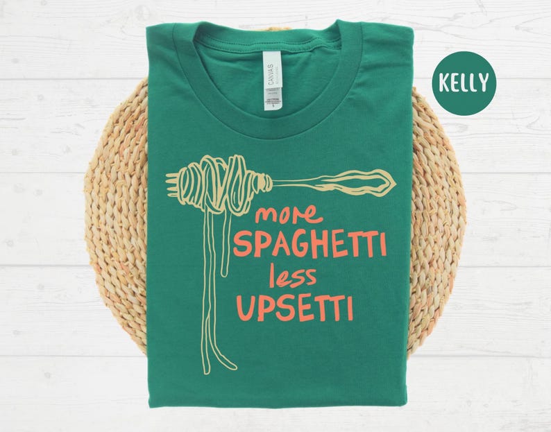 May include: Green t-shirt with a white spaghetti graphic and the text "more spaghetti less upsetti".